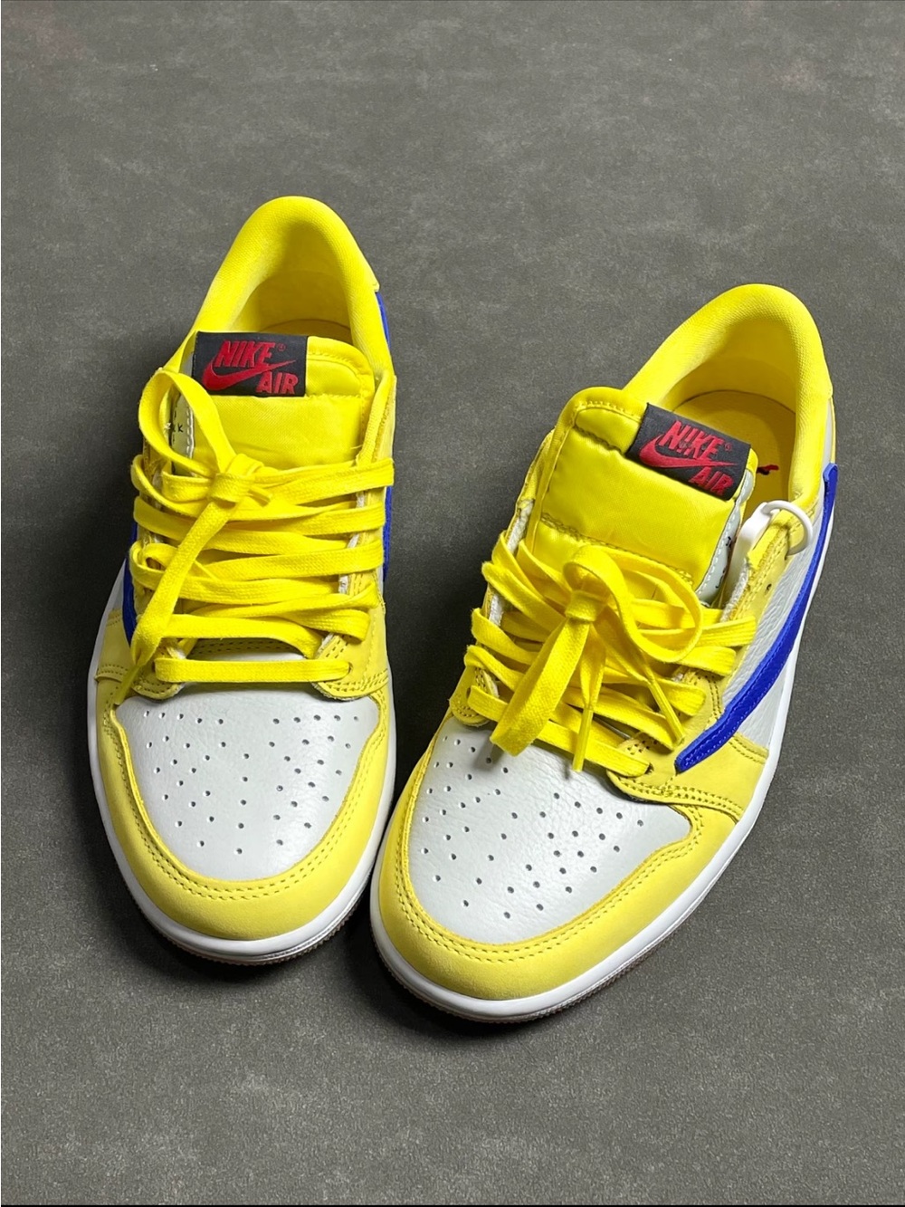 Travis Scott x Air Jordan 1 Low Yellow Blue Reverse Swoosh Low Top Sneakers